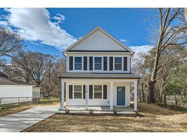 Charming two-story home with a welcoming front porch and a vibrant blue front door at 117 Mountain View St, Gastonia, NC 28052
