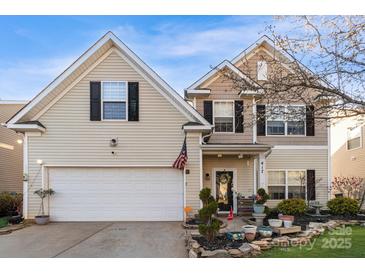 Inviting two-story home showcasing a well-kept lawn and a welcoming front entrance at 417 Galesburg Dr, Monroe, NC 28110