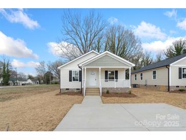 Charming single-story home featuring a cozy front porch and traditional architectural details at 423 N Caldwell St # 2, Salisbury, NC 28144