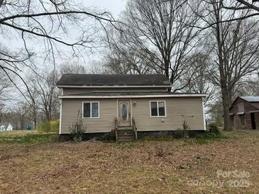 Charming single-story home with neutral siding, complemented by well-maintained landscaping and inviting entrance at 3708 Secrest Shortcut Rd, Monroe, NC 28110