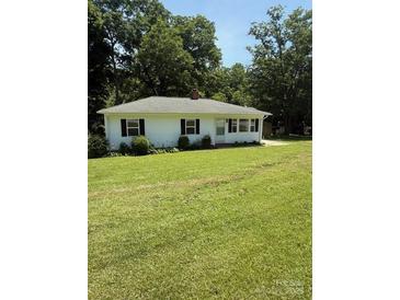 Charming one-story home featuring a well-manicured lawn and inviting curb appeal at 5949 Flat Creek Rd, Kershaw, SC 29067
