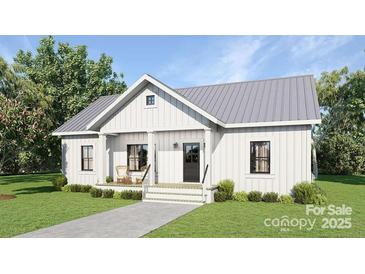 Charming exterior featuring vertical siding, a gray metal roof, a covered entry porch and a well-manicured lawn at 1469 32Nd Sw St, Hickory, NC 28602