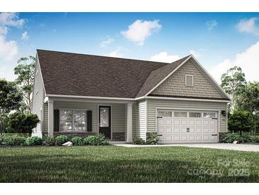 Charming single-story home with a two-car garage, neutral siding and well-maintained landscaping at 159 Wembury Ln, Troutman, NC 28166