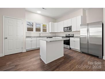 Modern kitchen featuring stainless steel appliances, an island, and ample cabinet space at 167 Saluda St, Chester, SC 29706