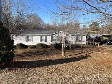 Charming single-story home featuring a welcoming front porch and well-maintained landscaping, perfect for comfortable living at 355 Branchwood Rd, Statesville, NC 28625