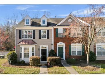 Charming townhomes featuring traditional architecture and well-maintained landscaping at 7364 Laurel Valley Rd, Charlotte, NC 28273