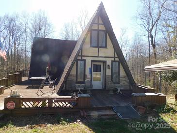 Charming A-frame home with a large deck perfect for outdoor relaxation and enjoying the natural surroundings at 13062 Highway 55 W Hwy, York, SC 29745