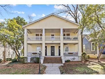 Charming two-story home with a yellow exterior, inviting porches, and well-maintained landscaping at 1517 Cleveland Ave # D, Charlotte, NC 28203