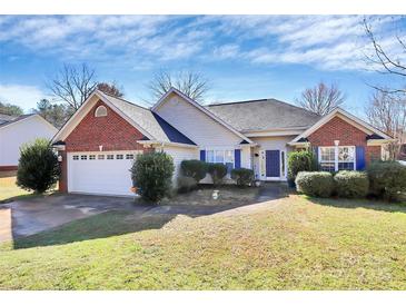 Charming single-story home with a brick accent, two-car garage, and a well-manicured lawn at 1229 Kent Dr, Lancaster, SC 29720