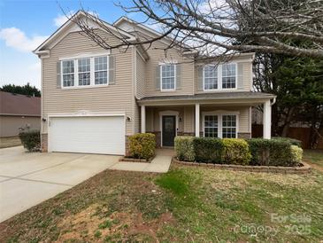 Charming two-story home featuring well-maintained landscaping and attached two-car garage at 1913 Leesburg Dr, Clover, SC 29710