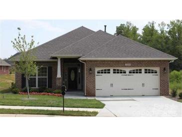 A charming single-story brick house featuring an attached two-car garage and manicured front lawn at 2608 Glyncastle Way, Gastonia, NC 28056