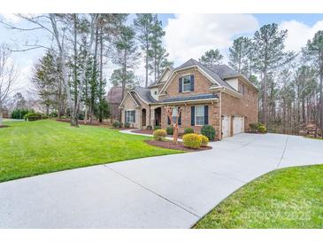 Beautiful brick home with a long driveway and well-manicured lawn in a desirable neighborhood at 303 Ridge Reserve Dr # 29, Clover, SC 29710