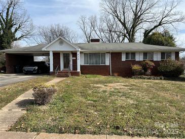 Charming brick ranch-style home with a covered carport and traditional architectural details at 816 Horah W St, Salisbury, NC 28144