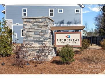 Elegant community sign for The Retreat at West Catawba, highlighting stone details and landscaping at 8233 Houser St, Cornelius, NC 28031