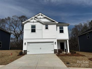 Two-story white house with a two-car garage and a modern architectural design at 307 Alden Ct, Shelby, NC 28152