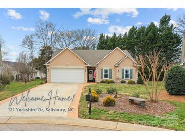 Charming single-Gathering home with a well-manicured lawn, a two-car garage, and a welcoming front entrance at 121 Yorkshire Dr, Salisbury, NC 28144