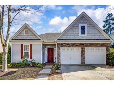 Charming single-Gathering home featuring a two-car garage and manicured lawn at 2316 Winding River Dr, Charlotte, NC 28214