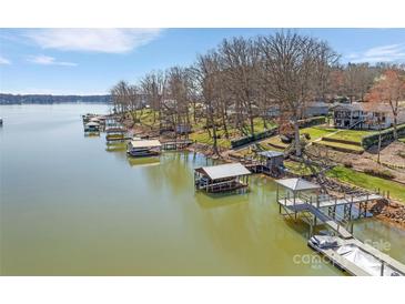 Picturesque lakefront property with boat docks and lush greenery at 5064 Lynwood Rd, Sherrills Ford, NC 28673