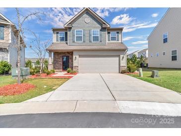 Charming two-story home featuring a two-car garage and manicured front lawn at 530 Silers Bald Dr, Fort Mill, SC 29715