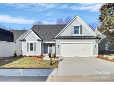 Charming single-Gathering home featuring a two-car garage and beautifully landscaped front yard at 1157 Bunch Dr, Statesville, NC 28677