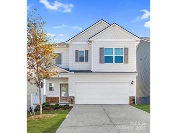 Charming two-story home with a two car garage and a well-manicured front yard at 2202 Catawba Trace Dr, Catawba, NC 28609
