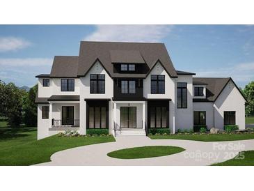 Stunning two-story home featuring a modern design, black window frames, and landscaped front yard at 13820 E Rocky River Rd, Davidson, NC 28036