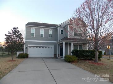 Charming two-story home features a two-car garage and well-manicured landscaping in a desirable neighborhood at 3500 Exbury Gardens Dr, Waxhaw, NC 28173