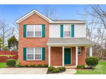 Charming two-story brick home featuring green shutters and a welcoming front porch at 1212 Shenandoah Cir, Rock Hill, SC 29730