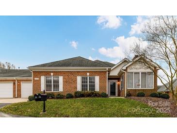 Charming brick home featuring white shutters and a well-maintained lawn, perfect for curb appeal at 11406 Olde Turnbury Ct, Charlotte, NC 28277