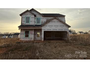 Unfinished two-story home with a two-car garage on a spacious lot at 122 Peppervine Ln, Statesville, NC 28625