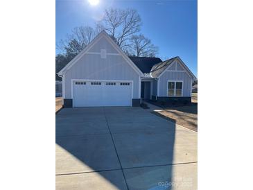 Charming one-story home with attached garage and welcoming entrance at 2358 Fay Jones Rd, Denver, NC 28037
