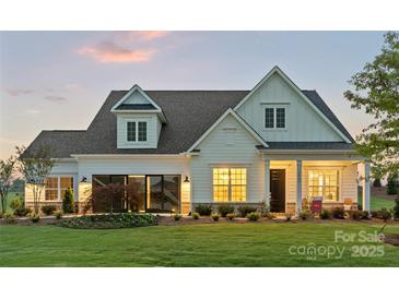 Charming two-story home with well-manicured lawn and inviting front porch at 5312 Allburn Pkwy, Concord, NC 28027