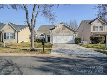 Charming single-Gathering home features a spacious driveway and inviting front yard with mature tree at 8545 Filbert Ln, Charlotte, NC 28215