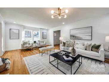 Bright living room features hardwood floors, contemporary decor, and plenty of natural light at 1081 Evergreen Cir, Rock Hill, SC 29732