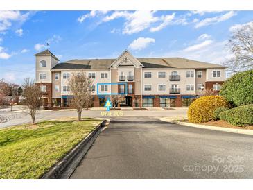 Attractive condo building with well-maintained landscaping, reserved parking, and convenient first-floor access at 1410 4Th Street Nw Dr # 205, Hickory, NC 28601