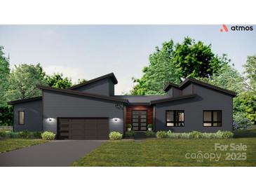 Stunning single-story modern home with sleek gray siding, a two-car garage, and a covered front entry at 1935 Weddington Rd # 1, Matthews, NC 28104