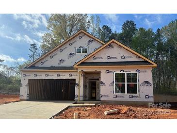 New construction home showing exterior framing, sheathing, and garage awaiting finishing touches at 149 Prestwick Way # 39, Mooresville, NC 28115