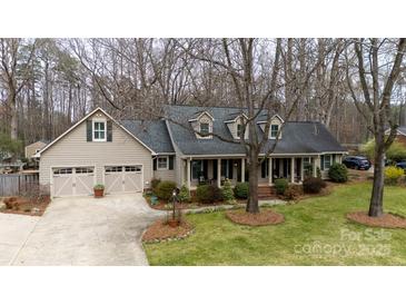 Charming home with a well-manicured lawn, a covered front porch, and an attached two-car garage at 2622 Oakhurst Dr # 23, Rock Hill, SC 29730