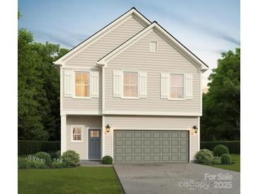 Charming two-story home with a gray garage door, complemented by white shutters and a well-manicured lawn at 5123 Izzo Ln, Charlotte, NC 28214