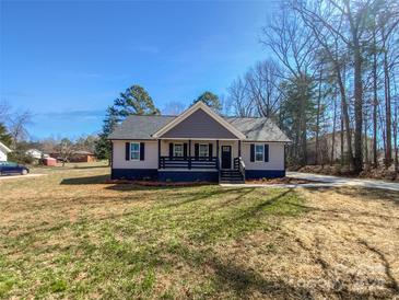 Charming one-story home with manicured lawn and inviting curb appeal, perfect for families or first-time buyers at 733 Baker St, Kannapolis, NC 28081