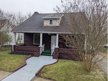 Charming single Gathering home with a brick foundation, covered porch, and well-maintained landscaping at 927 Locke St, Salisbury, NC 28144