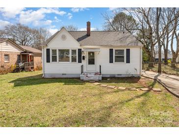 Charming one-story home with white siding, black shutters, and a well-maintained lawn at 502 Crawford St, Shelby, NC 28150