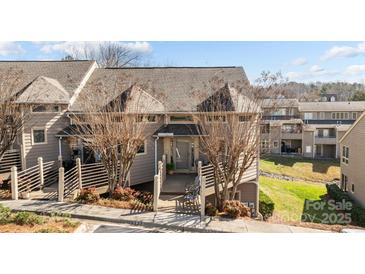 Charming townhome with a covered porch and attractive landscaping at 13913 Queens Harbor Rd, Charlotte, NC 28278