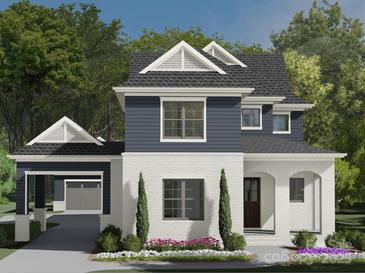 Charming two-story home featuring white brick, navy siding, and a welcoming covered porch at 19104 Newburg Hill Rd, Davidson, NC 28036