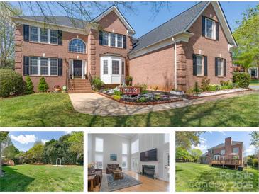 Traditional brick home featuring a manicured lawn, complemented by black shutters and tasteful landscaping at 3304 Taviston Dr, Waxhaw, NC 28173
