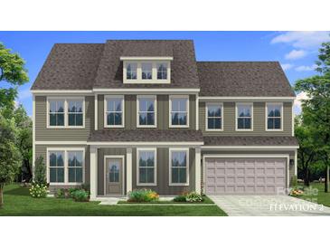 Charming two-story home featuring a well-maintained lawn and a welcoming front porch with columns at 261 Supernova Dr, York, SC 29745