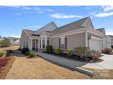 Charming single-story home featuring neutral siding, manicured landscaping, and an attached two-car garage at 3100 Azalea Dr, Fort Mill, SC 29707