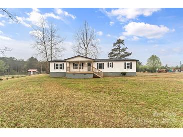 Charming single-story home with a covered front porch and spacious front yard at 1641 Knoll Dr, Vale, NC 28168