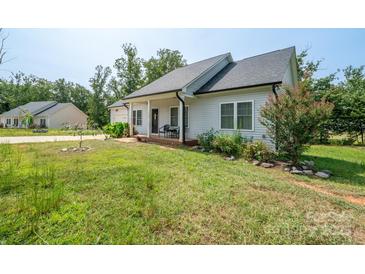 Charming single-story home featuring a well-maintained lawn and a cozy front porch with chairs at 1700 Ivey Ct, Maiden, NC 28650