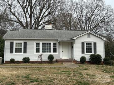 Charming single-story home with white siding, black shutters, and a well-maintained front yard at 501 Franklin Ave, Shelby, NC 28150